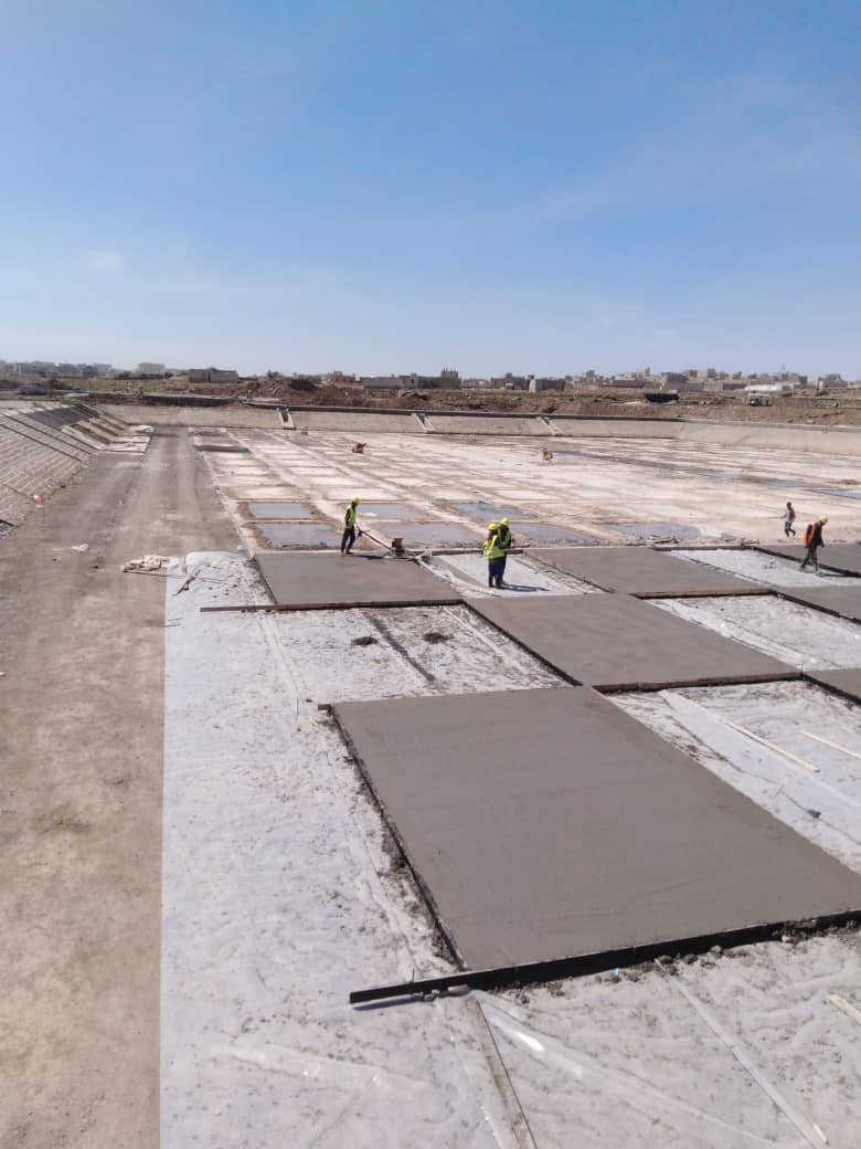 Concrete pouring in a checkerboard pattern to form engineering joints